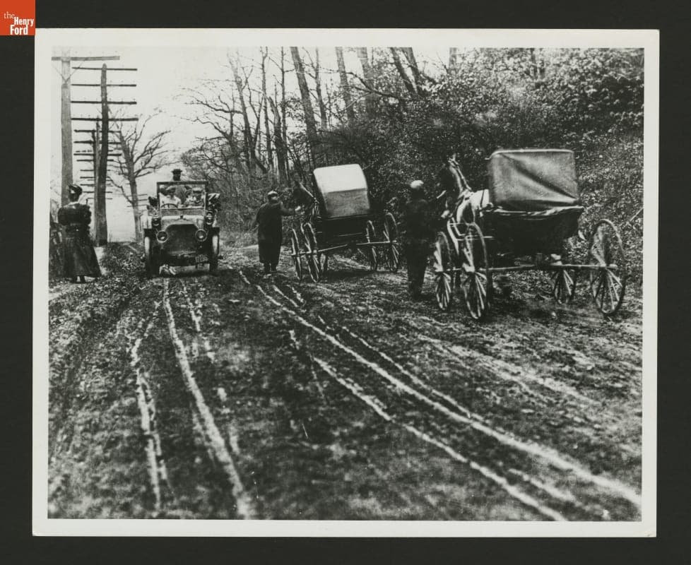 Automobile and Buggies on a Muddy Road, circa 1910