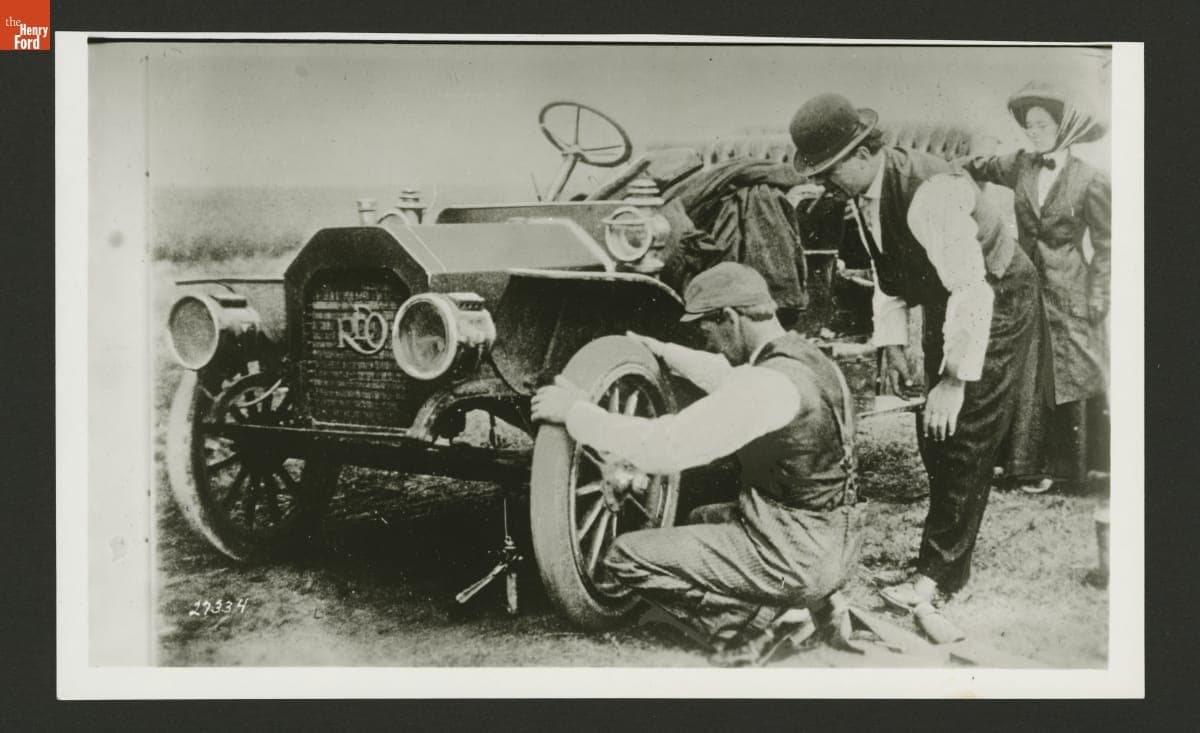 Fixing the Tire on an REO Automobile, 1900-1909
