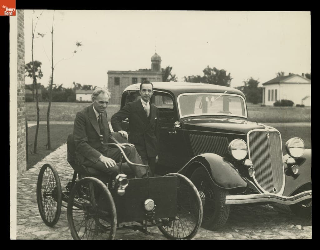 Henry Ford in the 1896 Quadricycle and Edsel Ford with a New Ford V-8 Car, Greenfield Village, 1933