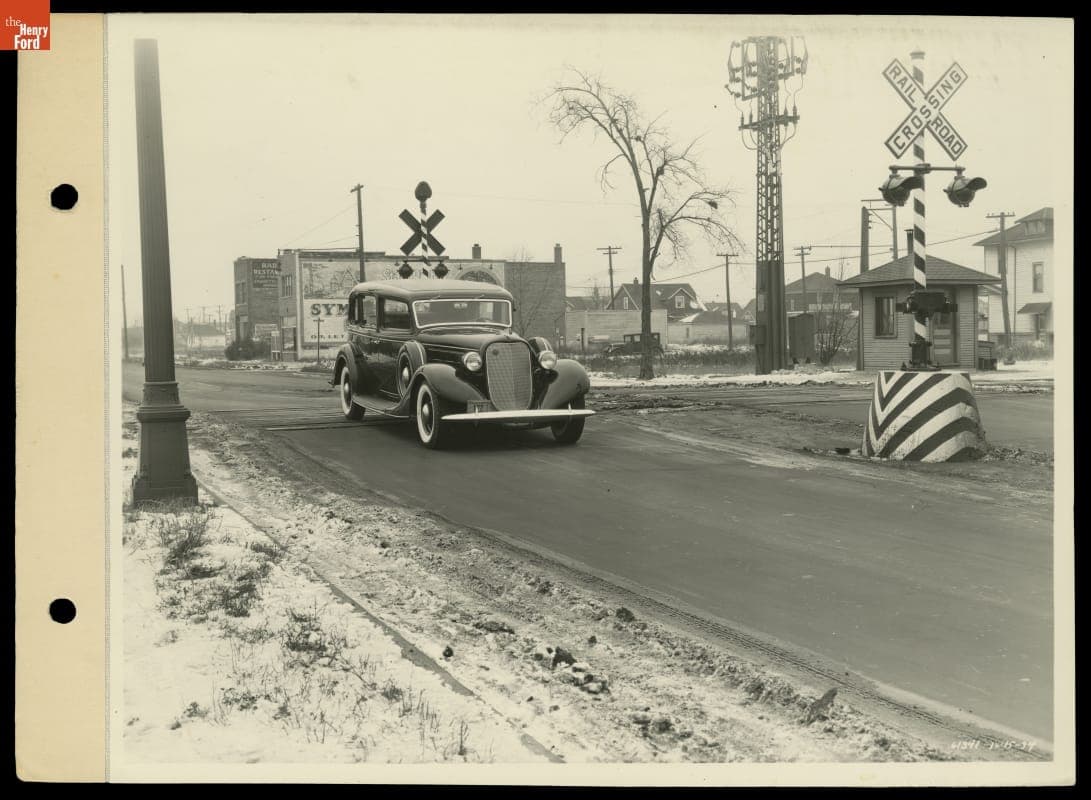 Lincoln Seven-Passenger Sedan Crossing Railroad Tracks, December 1934