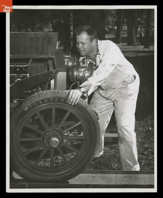Henry Austin Clark, Jr. Cranking a 1907 Locomobile Car on the Glidden Tour, 1957