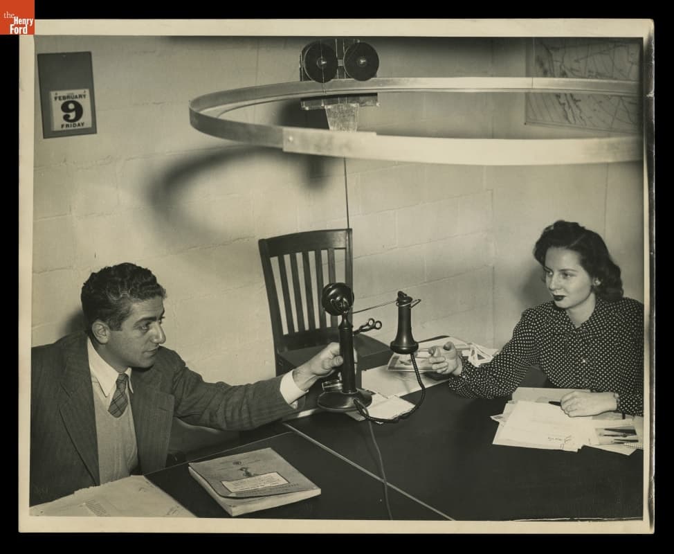 Sharing a Fuller Tension-Hung Wartime Telephone in the Dymaxion Dwelling Machines Inc. Office, 1945