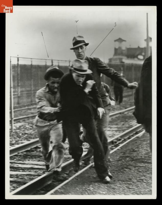 Ford Service Department Men Chase Union Official Robert Sentman during the Battle of the Overpass, May 26, 1937