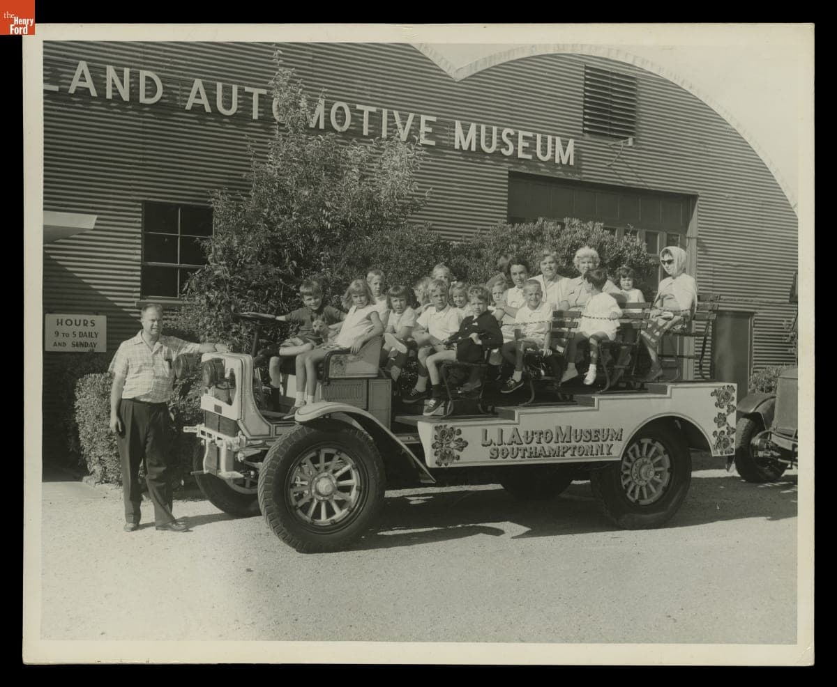 Henry Austin Clark, Jr. with Visitors in 1921 Autocar Rubberneck Bus at Long Island Automotive Museum, circa 1962