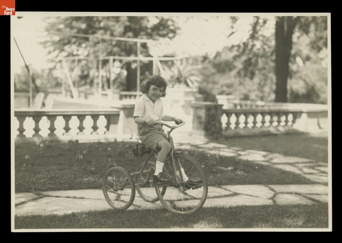 William Clay Ford, Age 4, Riding a Tricycle at Fair Lane, 1929