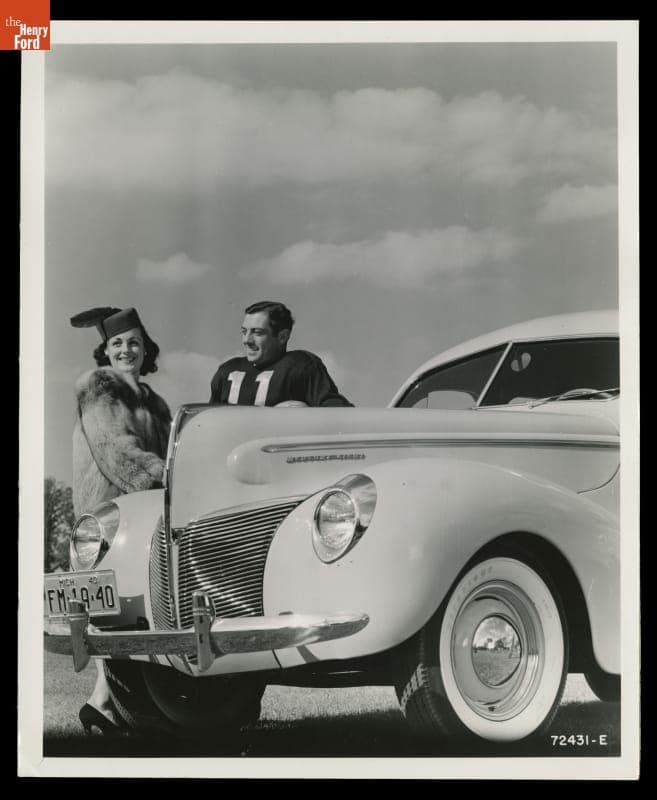 Advertising Photograph, Young Woman and Football Player with a 1940 Mercury Town Sedan