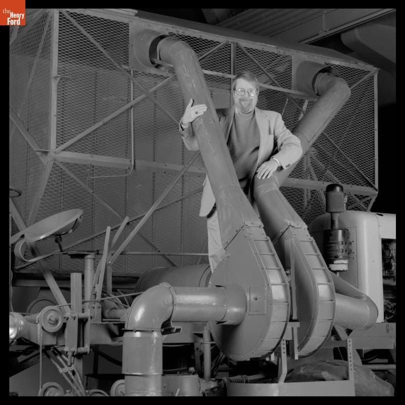 Peter Cousins with Rust Cotton Picker in Henry Ford Museum, 1995