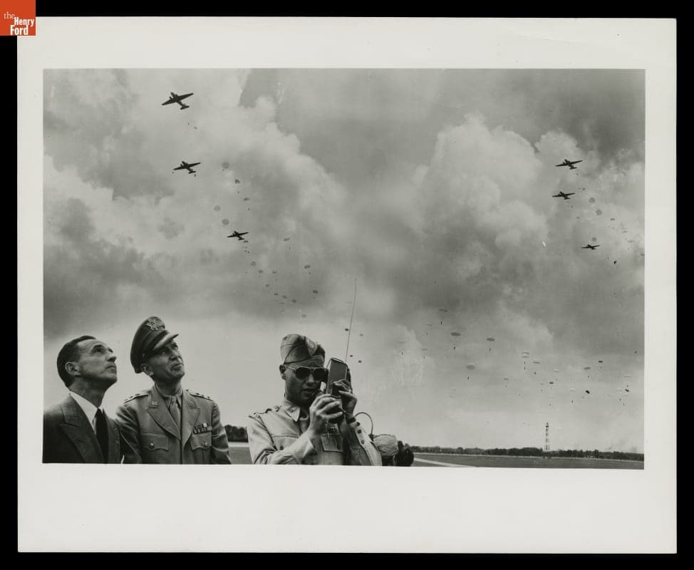 Edsel Ford and Lieutenant General Somervell Watching Demonstration of Paratroop Jumping at Ford Airport, July 4, 1942