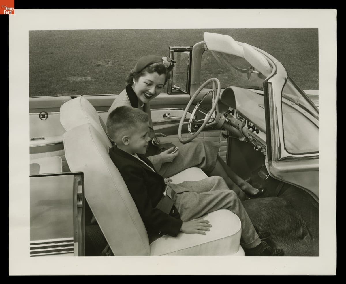 Mother and Son Demonstrating Safety Features of 1956 Ford Fairlane Sunliner Convertible, 1955