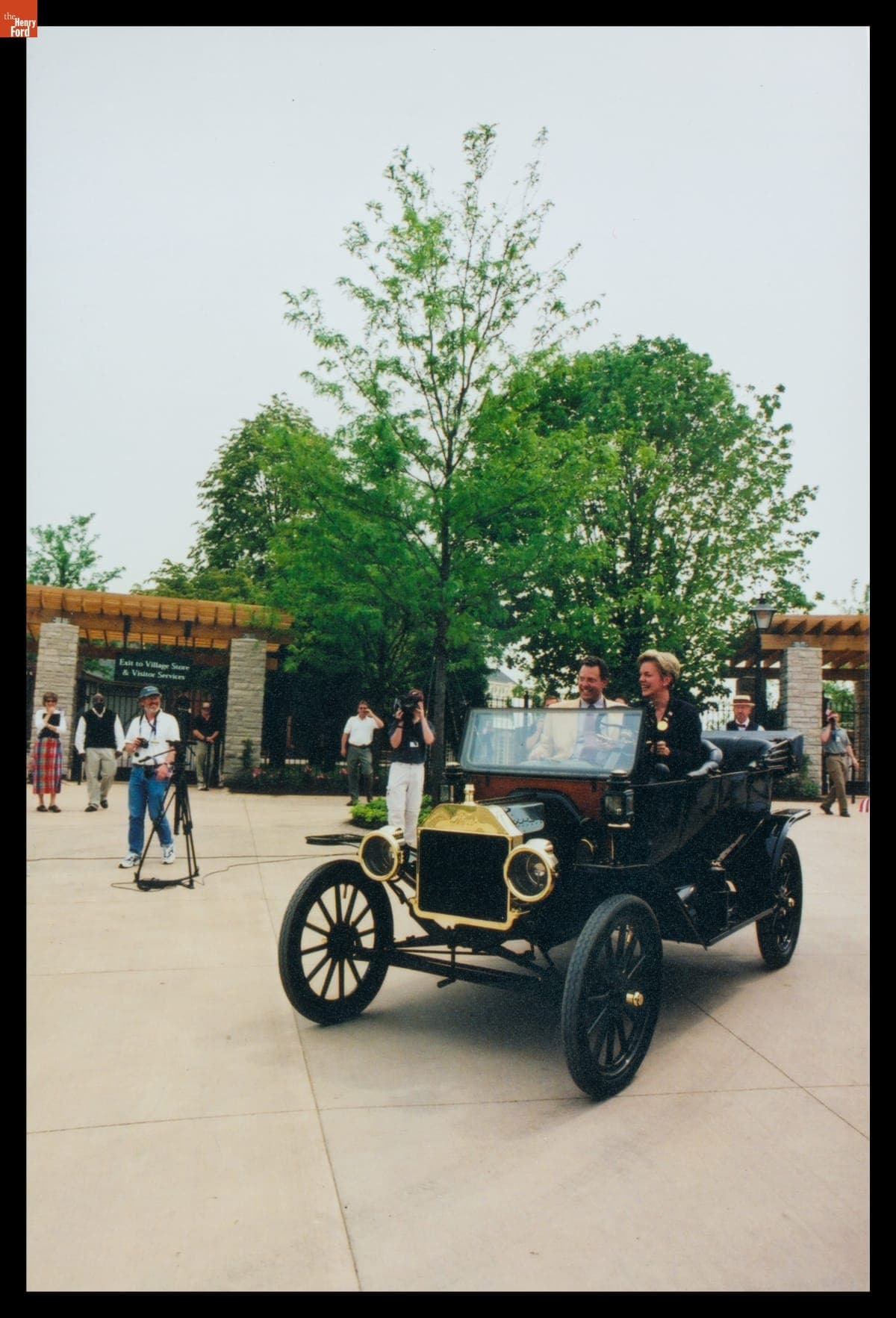 Governor Jennifer Granholm and Steven K. Hamp Driving a Ford Model T at the Re-Opening of Greenfield Village, 2003