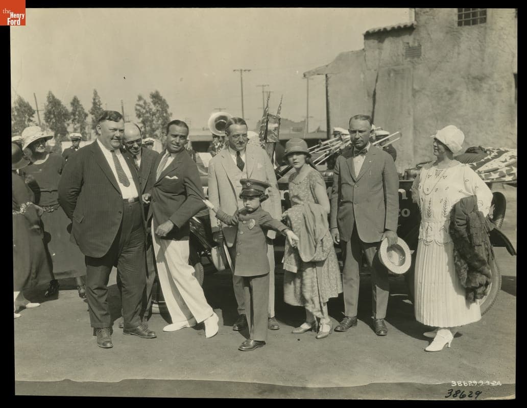 Douglas Fairbanks (Being "Arrested") and Mary Pickford with the Ten-Millionth Ford Model T, 1924