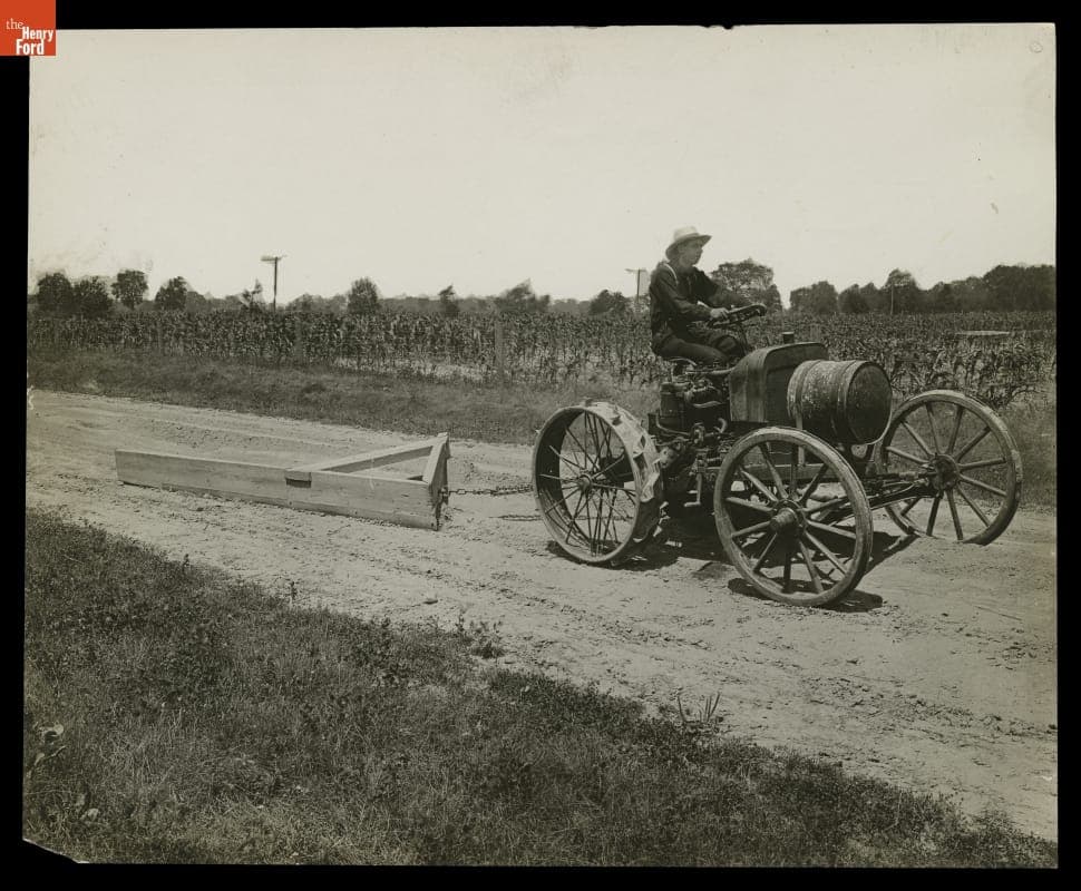 Burt W. Scott Operating the Second Experimental Ford Tractor, circa 1906-1907