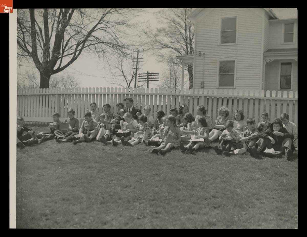 Children Eating Lunch outside Saline School, Saline, Michigan, April 1945