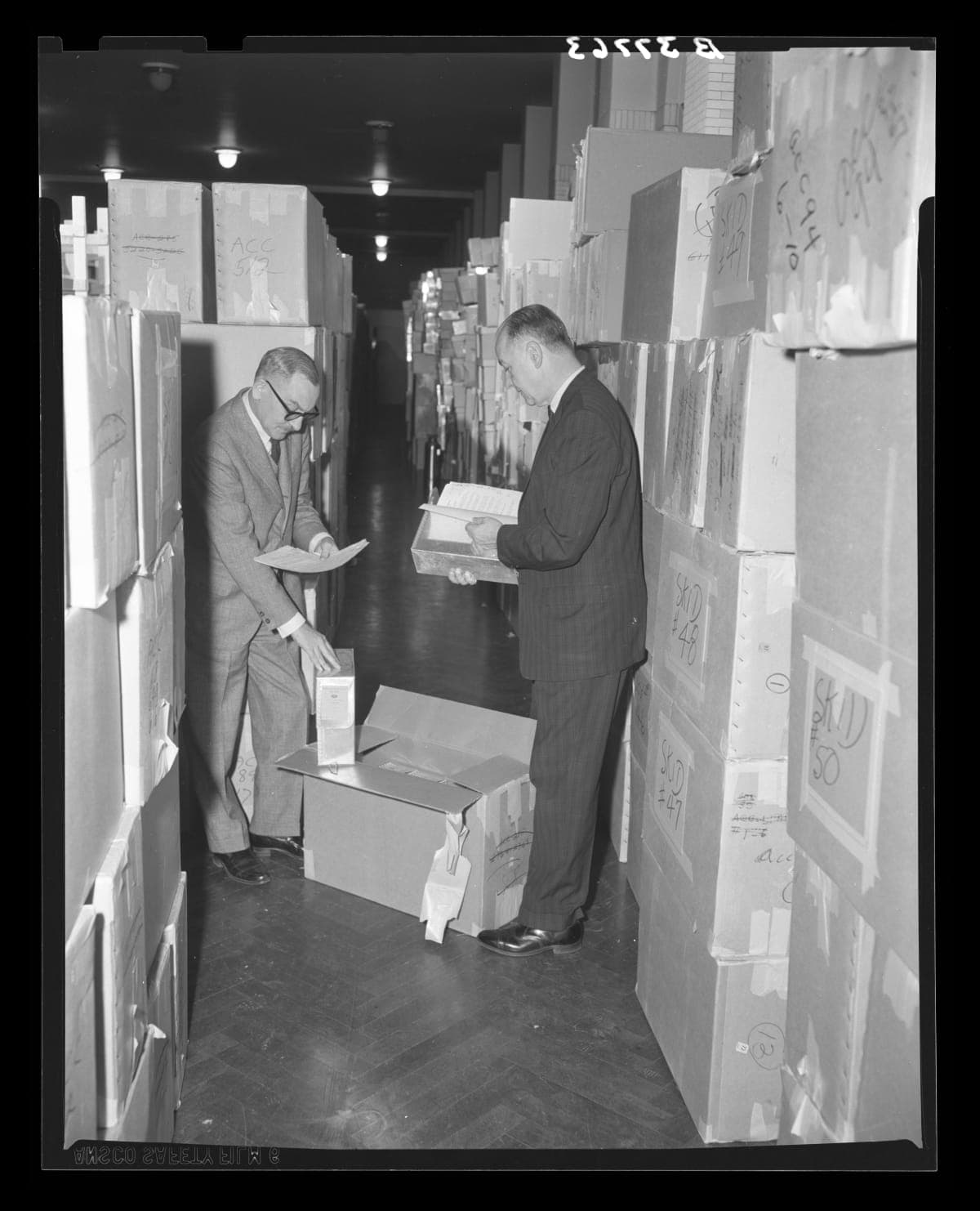 Donald A. Shelley, Executive Director, and Henry Edmunds, Archives Director, Examining Ford Archives Material after Arrival at Henry Ford Museum, December 30, 1964
