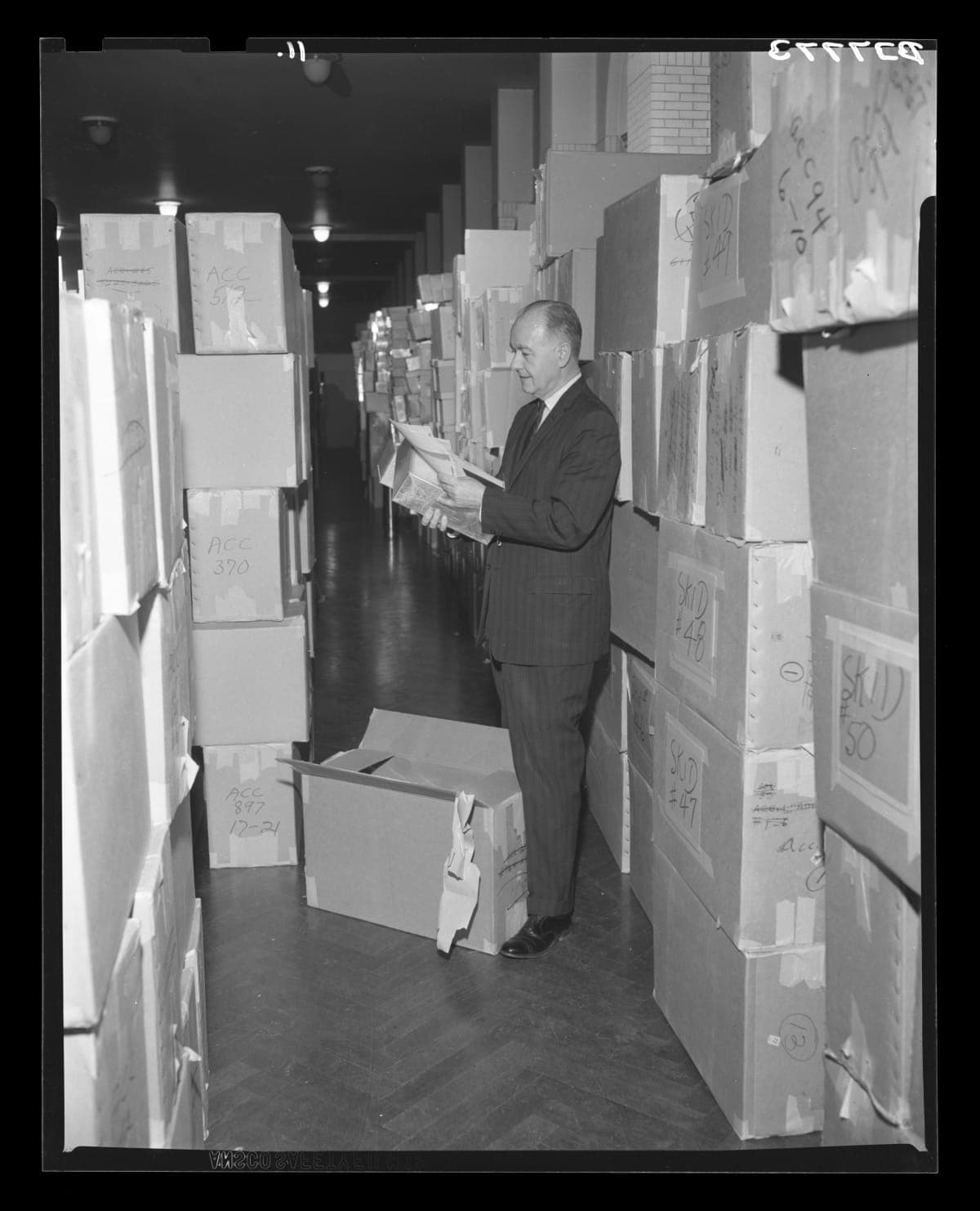 Donald A. Shelley, Executive Director, Examining Ford Archives Material after Arrival at Henry Ford Museum, January 18, 1965