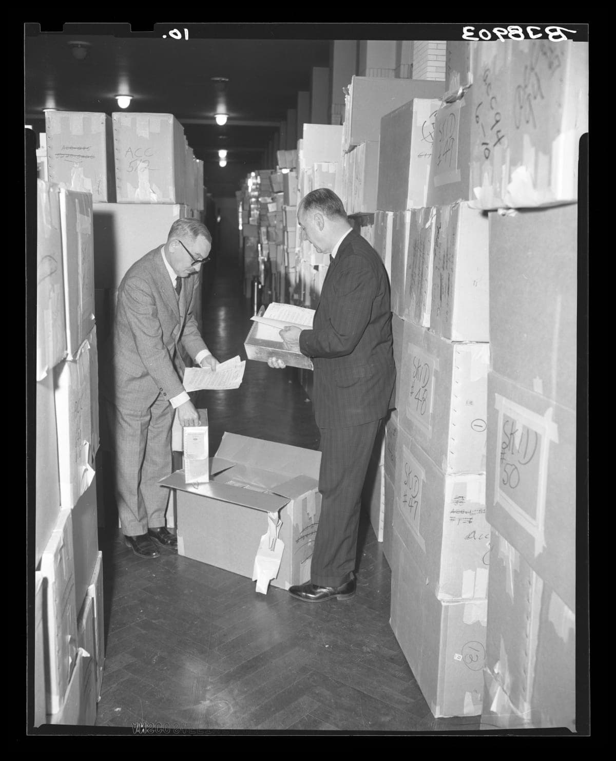 Donald A. Shelley, Executive Director, and Henry Edmunds, Archives Director, Examining Ford Archives on Arrival at Henry Ford Museum, December 31, 1964