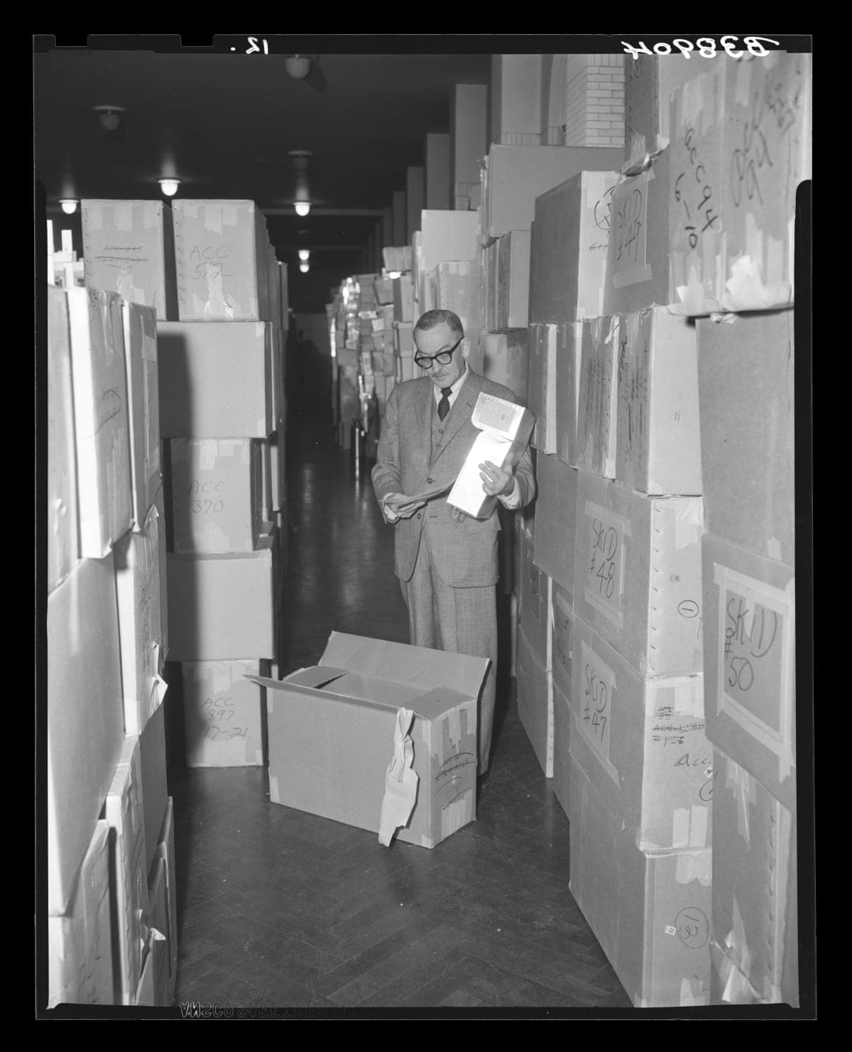 Henry Edmunds, Archives Director, Examining Ford Archives on Arrival at Henry Ford Museum, December 31, 1964