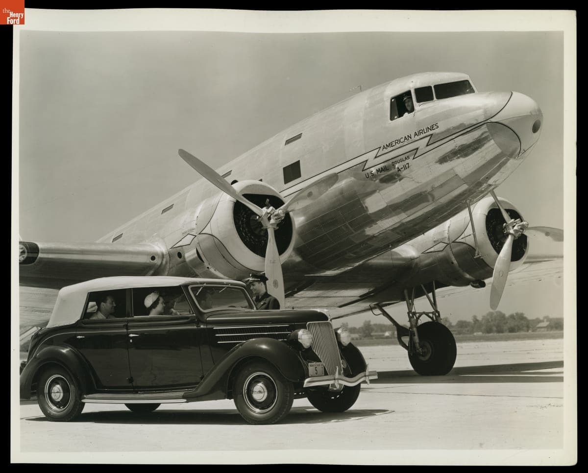 Ford V-8 Convertible Sedan alongside an American Airlines Douglas DC-3 Airplane, June 19, 1936