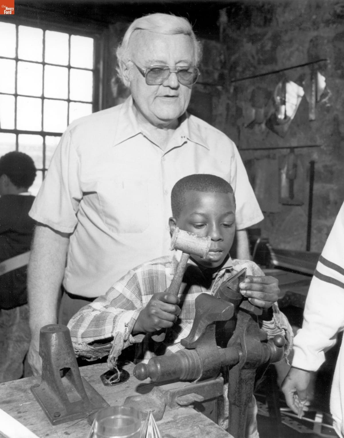 Elementary School Student Learning from a Tinsmith in Greenfield Village, March 9, 1990
