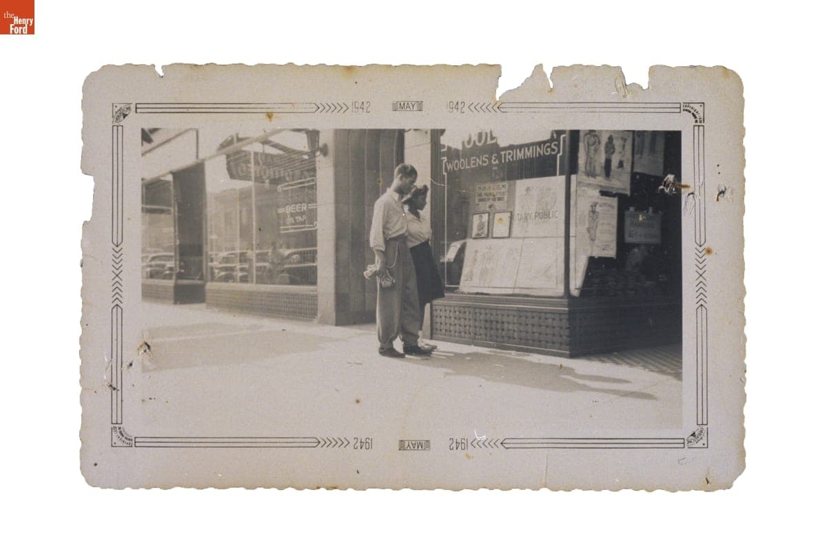 A Man and Woman Looking at the Display Window at Fox Brothers Clothier, Chicago, Illinois, May 1942