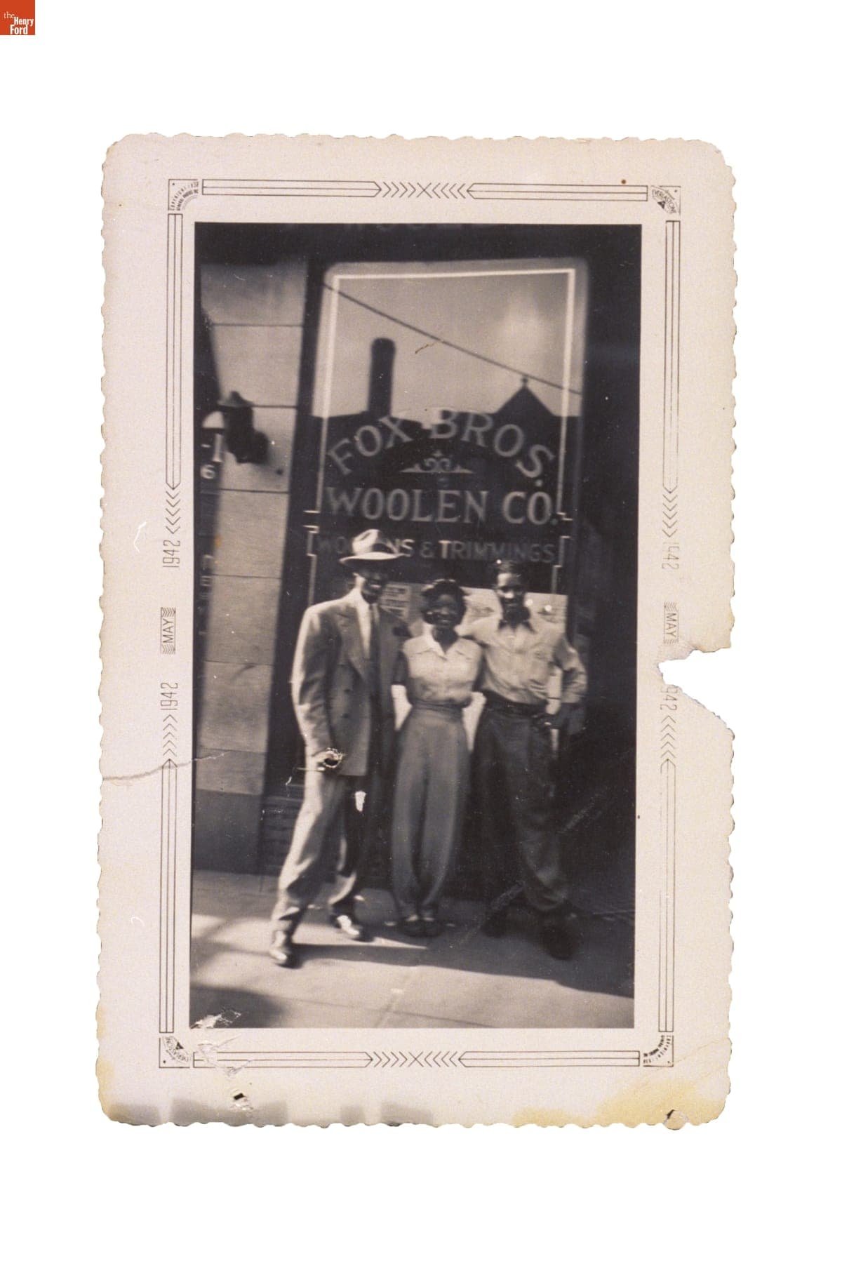 Man in a Zoot Suit, with a Woman and Another Man outside Fox Brothers Clothier, Chicago, Illinois, May 1942