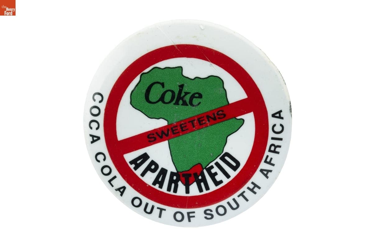 "Coke Sweetens Apartheid: Coca Cola Out Of South Africa" Button, 1985
