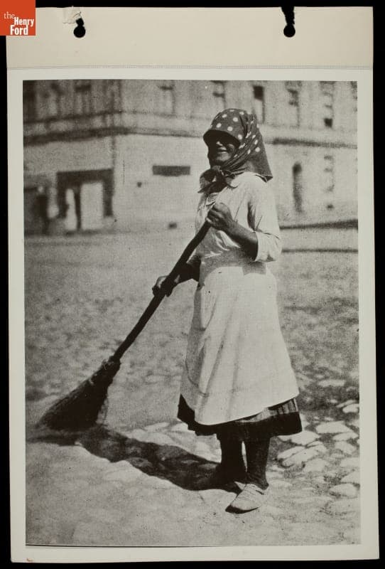 Woman Sweeping Stone-Paved Street, 1934