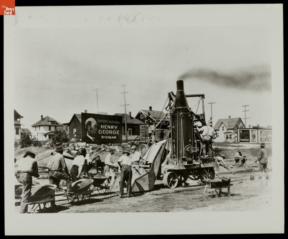 Steam Mixer Laying Concrete during Road Construction, 1910-1920