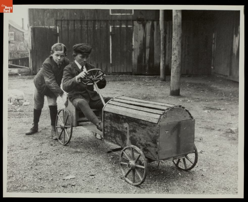 Boys Playing with Toy Race Car, circa 1910