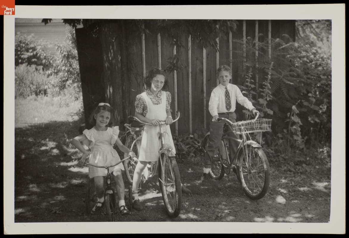 Three Children with Bicycles, circa 1940