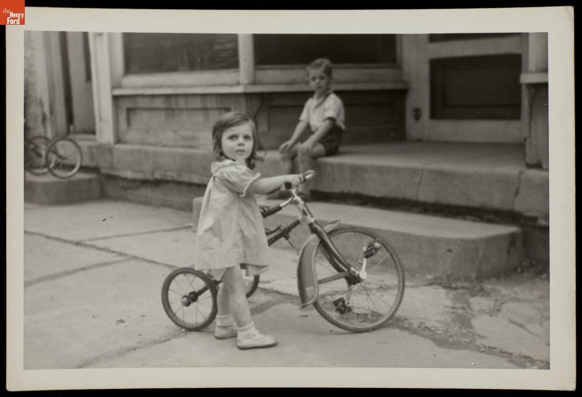 Boy and Girl with a Tricycle, circa 1940