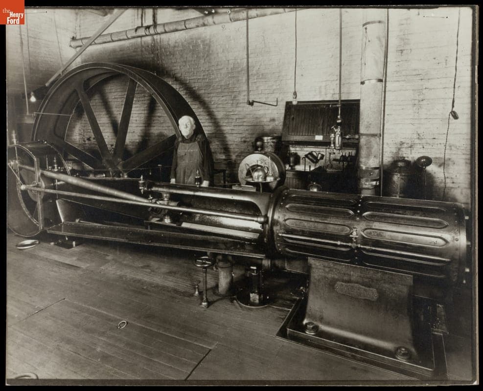 Machine Operator Standing Behind Brown Horizontal Steam Engine, circa 1890