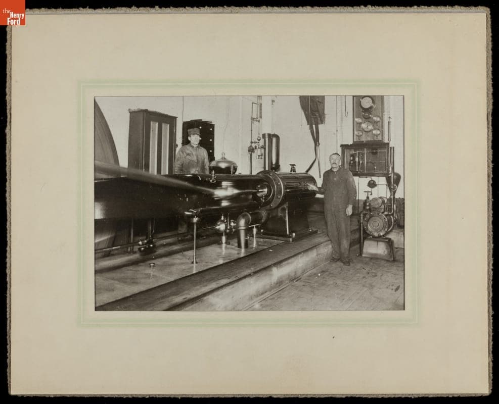 Two Machinists Standing with Brown Horizontal Engine, circa 1910
