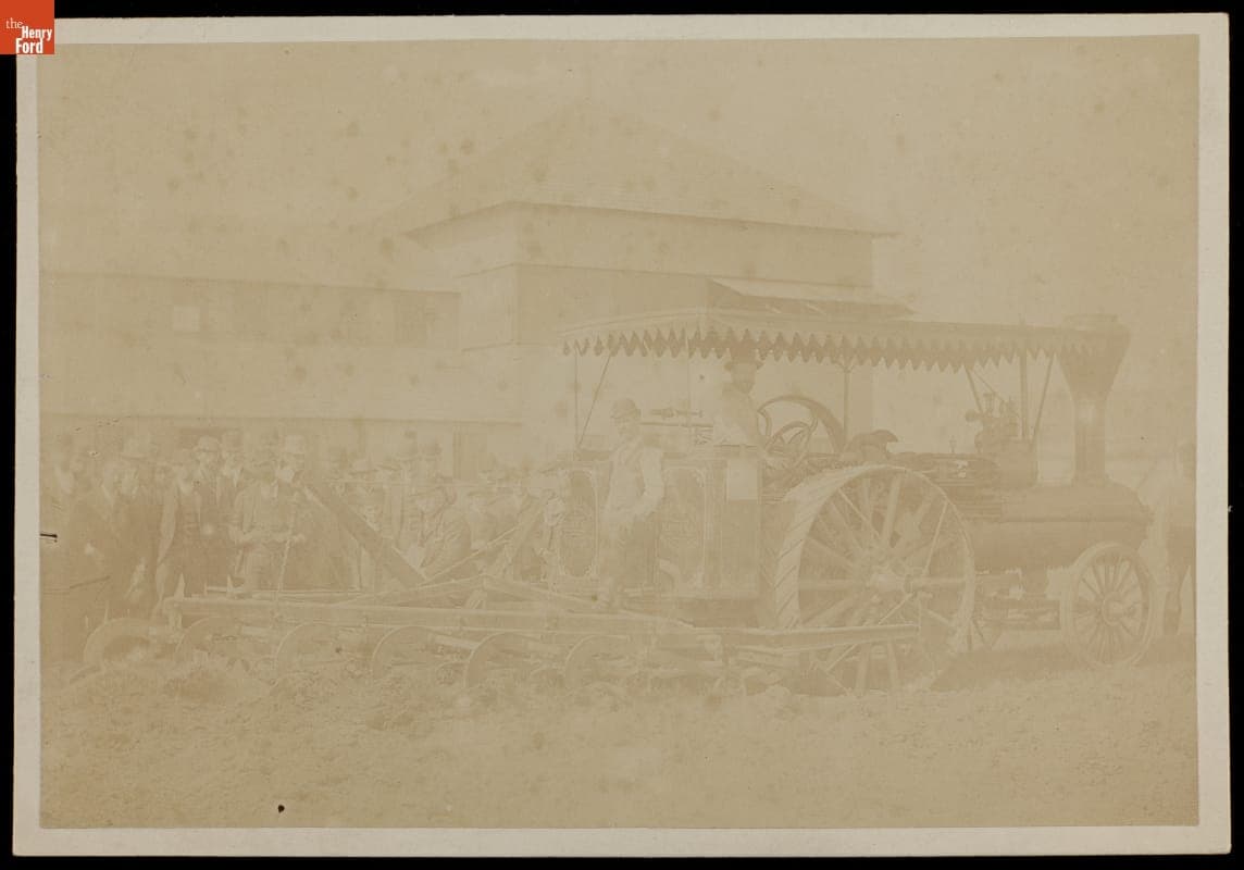 Engineer and Fireman aboard Traction Engine, Pulling Cultivator, circa 1895