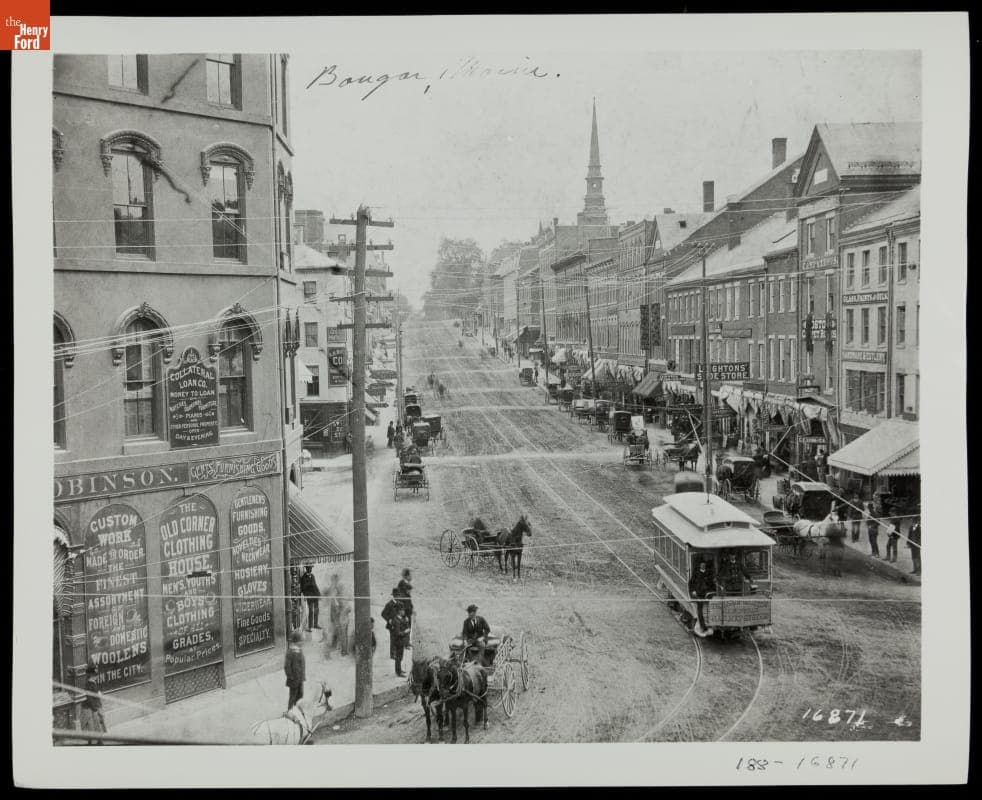 Electric Streetcar and Horse-Drawn Vehicles on City Street in Bangor, Maine, circa 1885