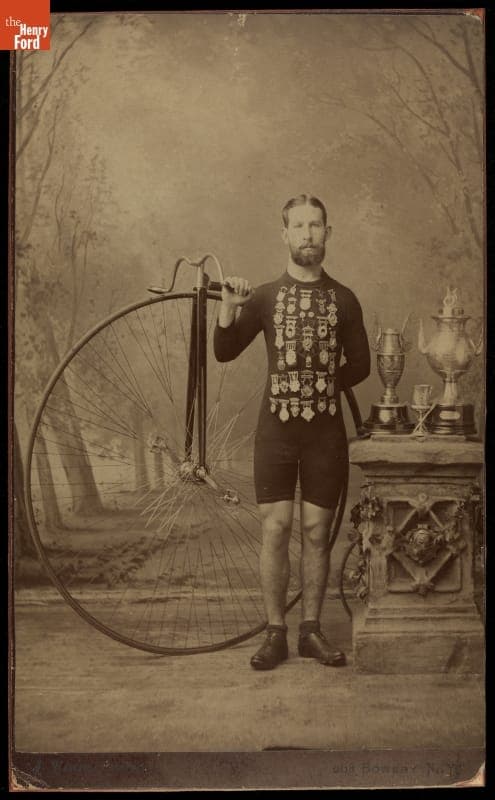 Cyclist Eugene Valentine with Bicycle and Medals, 1870-1887