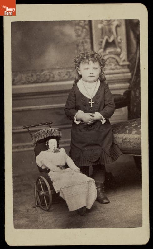 Young Girl with Doll and Doll Buggy, circa 1880