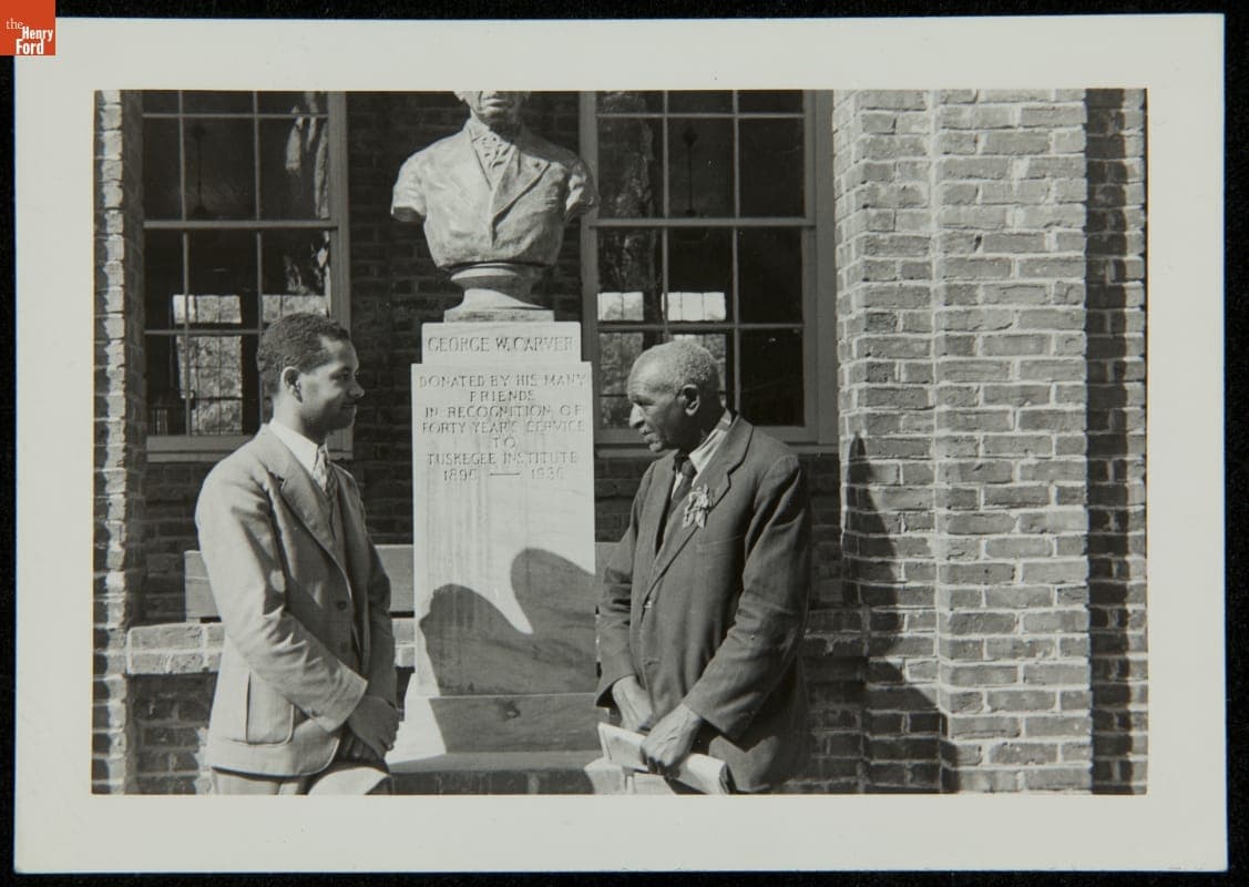 George Washington Carver and Austin W. Curtis, Jr. at Tuskegee Institute with Sculpture by Steffen Thomas, circa 1938