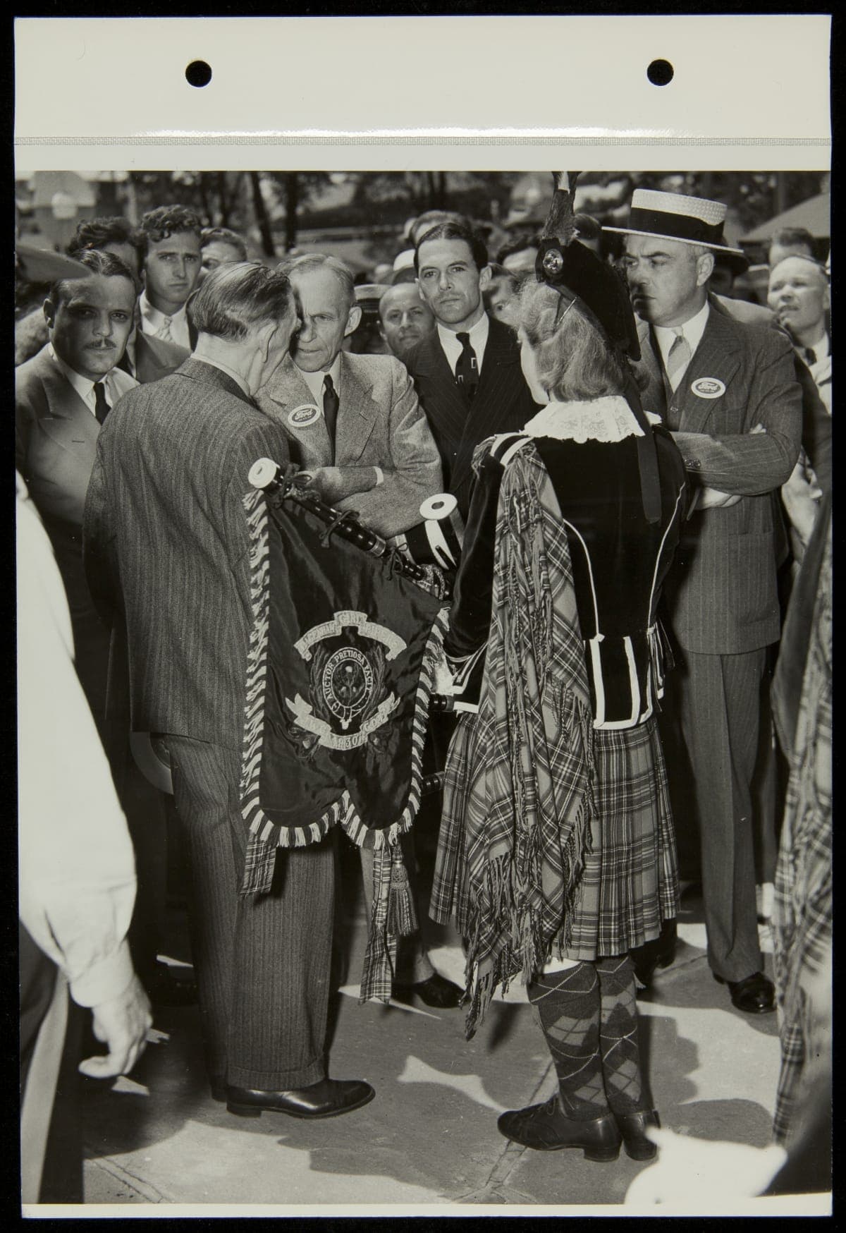 Henry Ford with Pipe Major Edith Turnbull, Dagenham Girl Pipers at the New York World's Fair, 1939