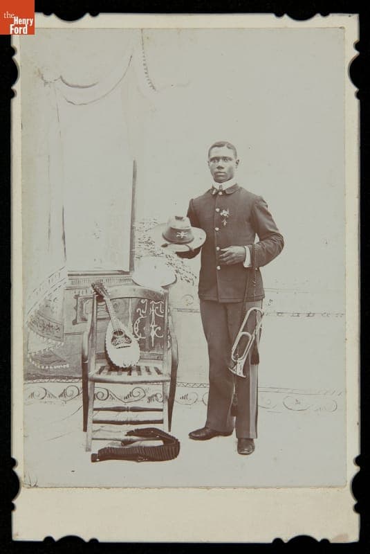 John McKinney of the 10th U.S. Cavalry, Posing with Bugle and Mandolin, 1899-1902