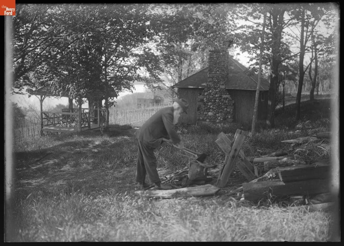 John Burroughs Chopping Wood near His Study at Riverby, 1910-1920