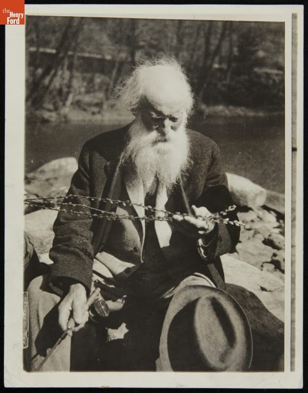 John Burroughs Fishing and Examining Pussy-Willows, circa 1919