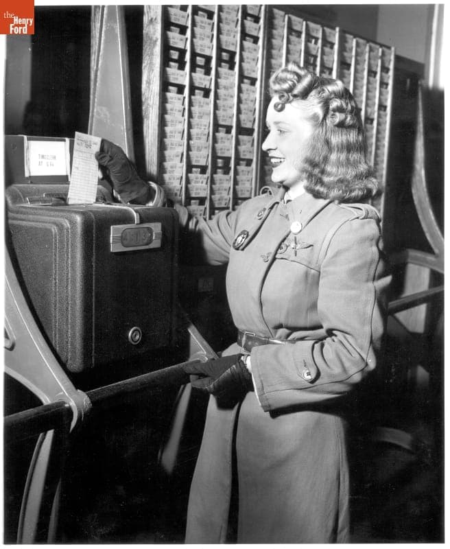Norma Denton Using the Time Clock at Willow Run Bomber Plant, 1943