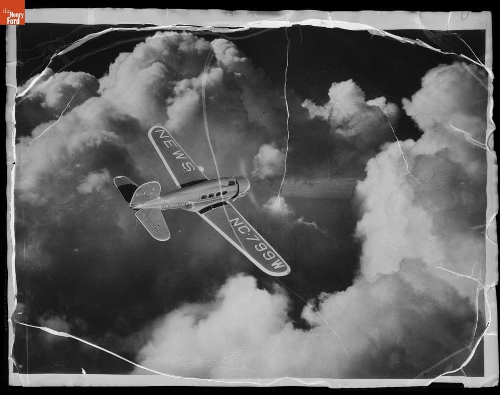 Detroit News--Airplane--Lockheed Orion--Early Bird--Closeups--In Flight--Going into the Clouds--Item2
