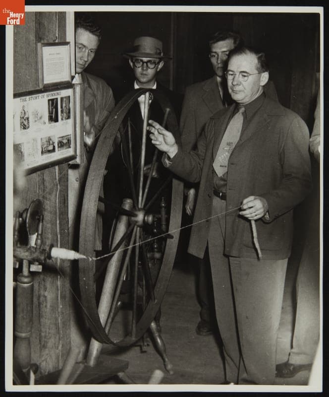 Sidney Holloway Spinning Carded Wool in Plymouth Carding Mill (now Gunsolly Carding Mill), Greenfield Village, circa 1949