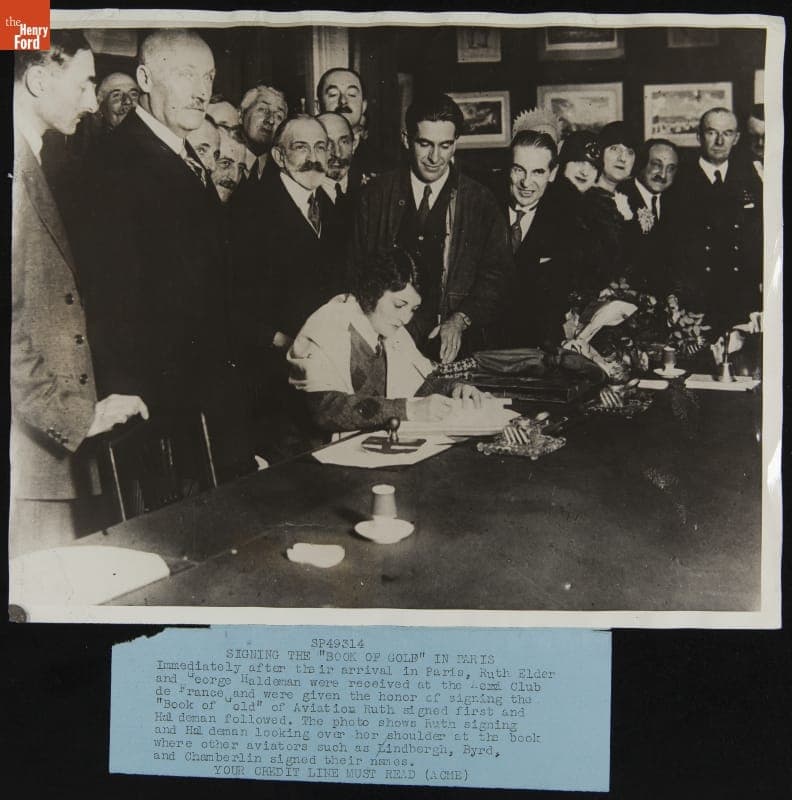 Ruth Elder Signing the Book of Gold with George Haldeman, Aero-Club de France, October 1927