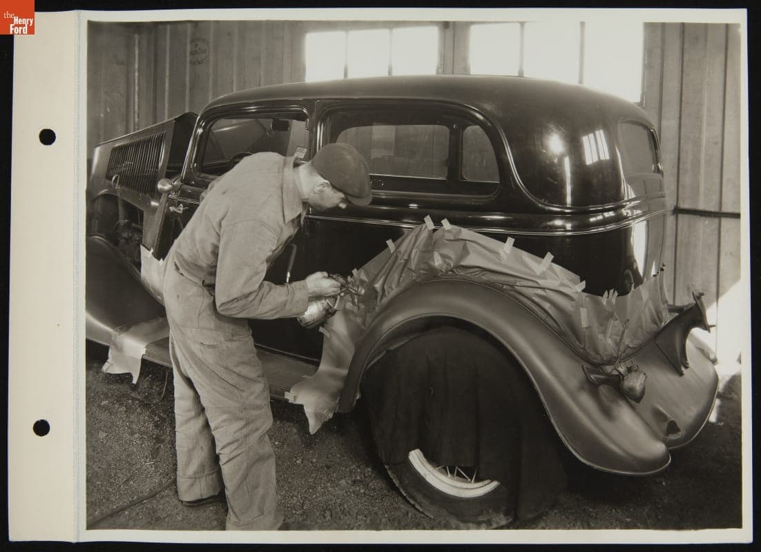 Worker Spray-Painting a Used Car, March 1935