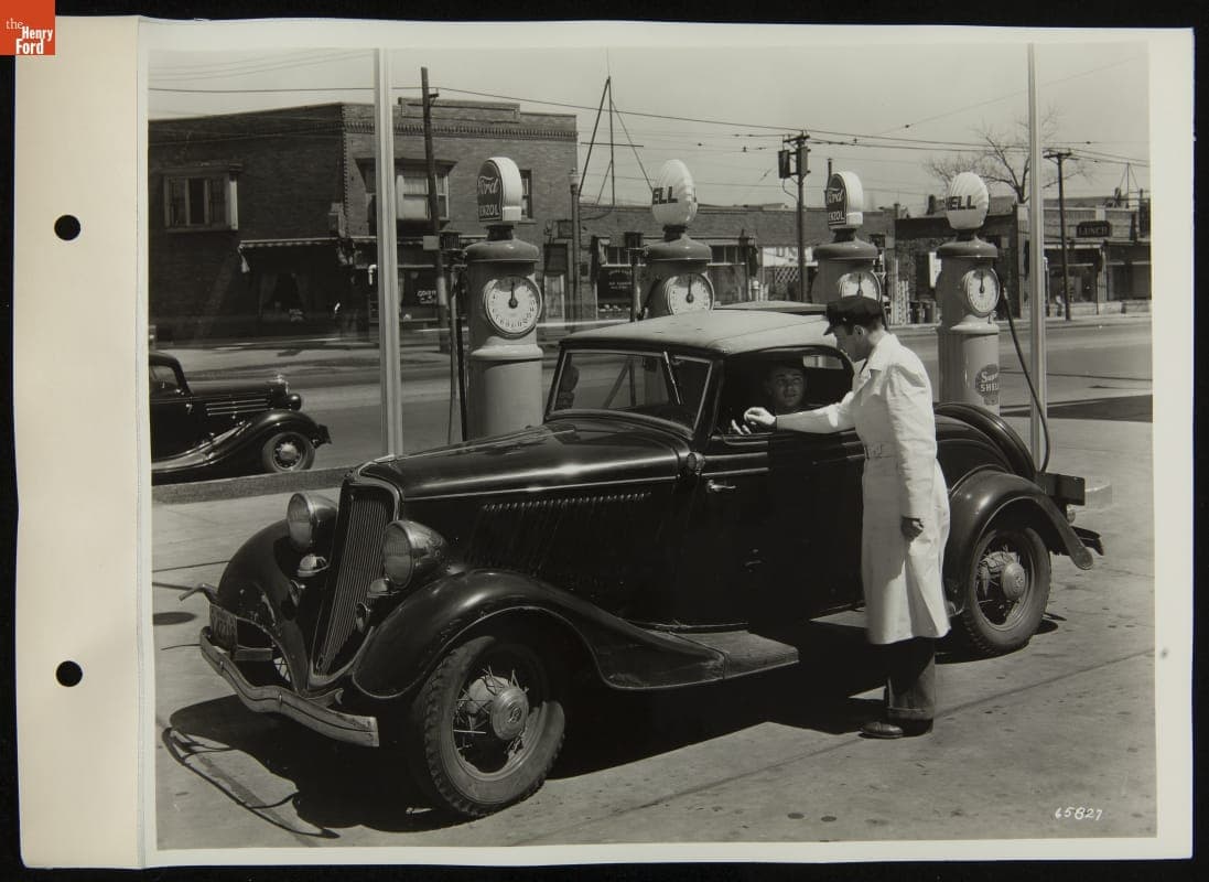Service Station Attendant Talking to Driver near Fuel Pumps, April 1936