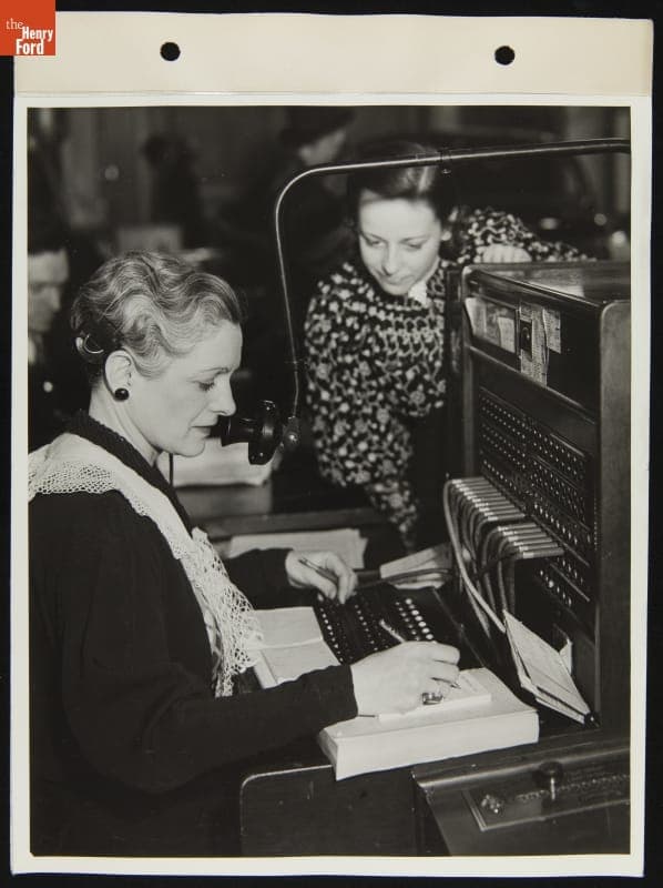 Switchboard Operator at George Holzbaugh Ford Dealership, West Grand Boulevard and Fort, Detroit, Michigan, January 1936
