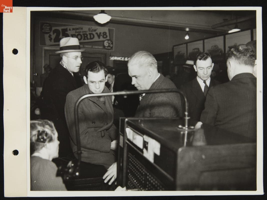 Crowd Gathered Near Switchboard Operator at George Holzbaugh Ford Dealership, West Grand Boulevard and Fort, Detroit, Michigan, January 1936